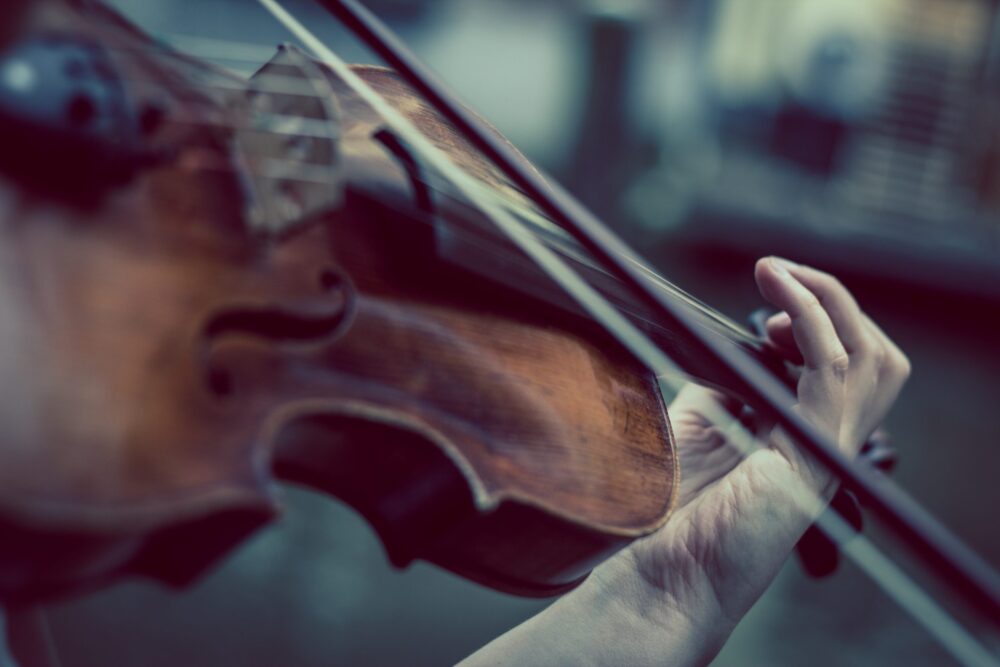 An image of a violin being played